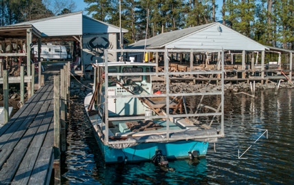 Crabbing boat and crab house and shedder facility.