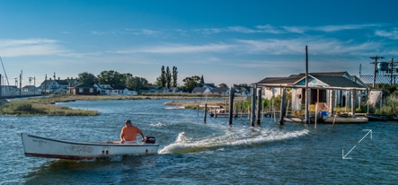 A skiff leaving Tangier Island to get his fishing boat.
